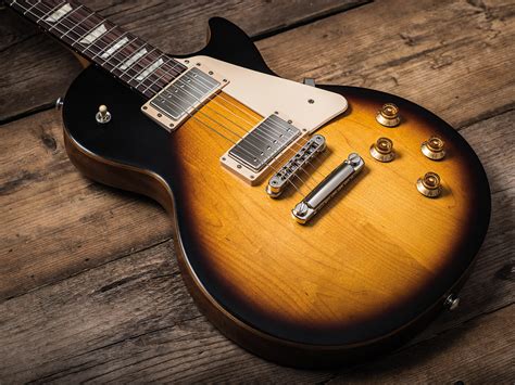 why are gibson les paul tributes so cheap